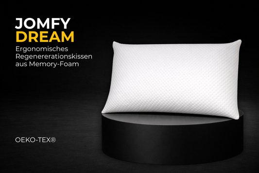 Ergonomisches Regenerationskissen JOMFY DREAM aus Memory-Foam auf schwarzem Podest, minimalistisches Produktbild mit OEKO-TEX®-Zertifizierung.